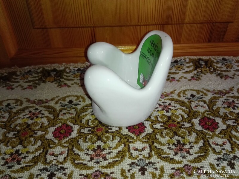 Porcelain table phone holder.