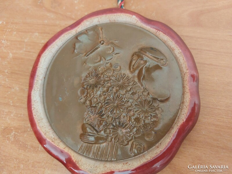(K) marked bronze relief, plaque on ceramic 11 cm, damage photographed