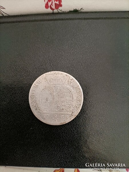 They're just messing around! Old silver money from 1768. Taller