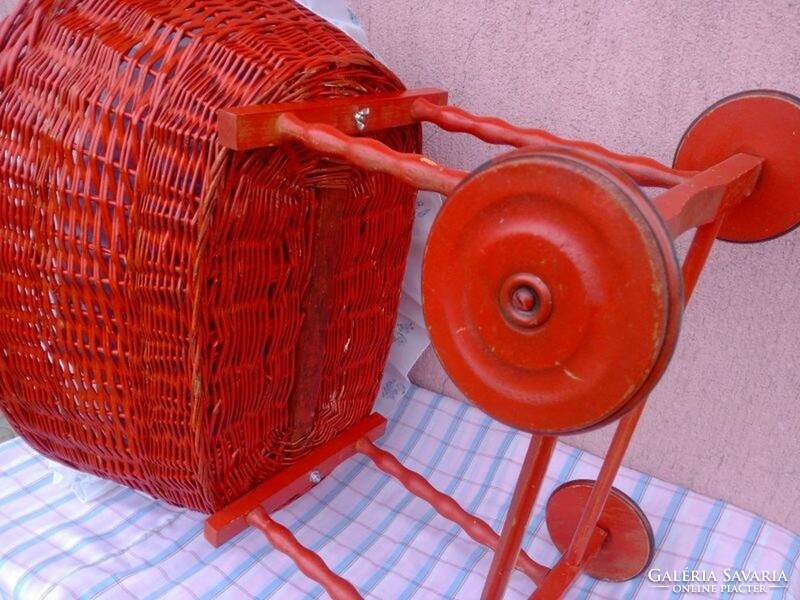 Retro rocking stroller with wooden frame, wicker basket with bedding, sunshade
