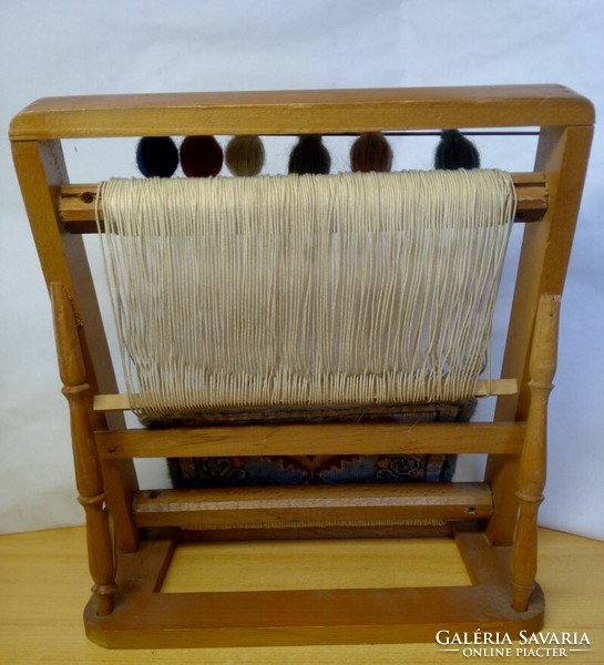 Old loom model. Ma-tex semi-finished carpet with decoration, wooden frame