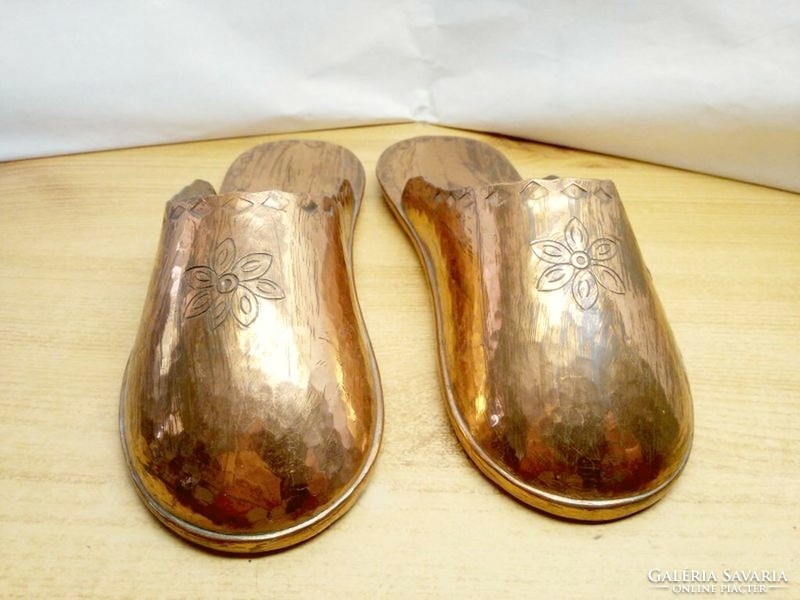 A pair of handmade red copper slippers, a rarity that can be placed on the wall or on a shelf