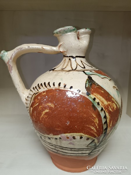 Rattling earthenware jug