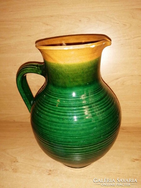 Green glazed ceramic jug, spout 23 cm