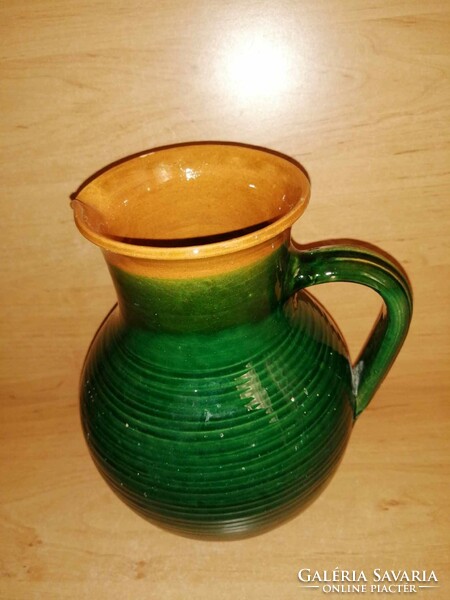 Green glazed ceramic jug, spout 23 cm