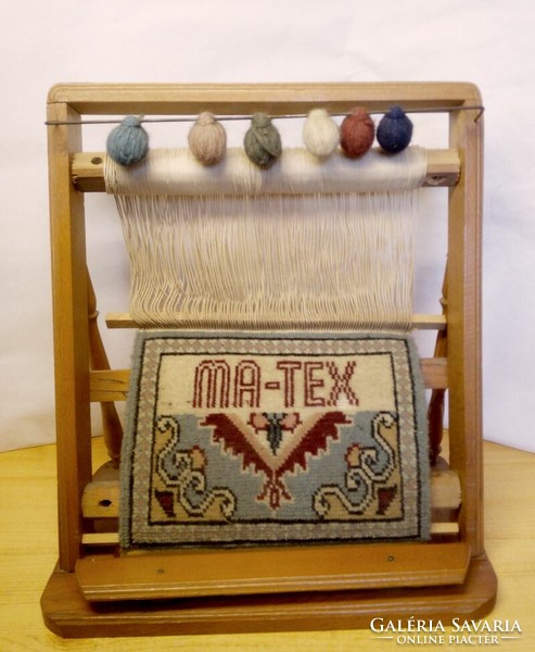 Old loom model. Ma-tex semi-finished carpet with decoration, wooden frame
