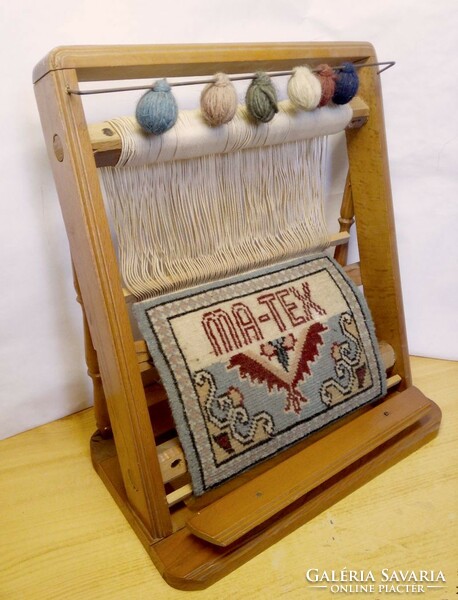 Old loom model. Ma-tex semi-finished carpet with decoration, wooden frame