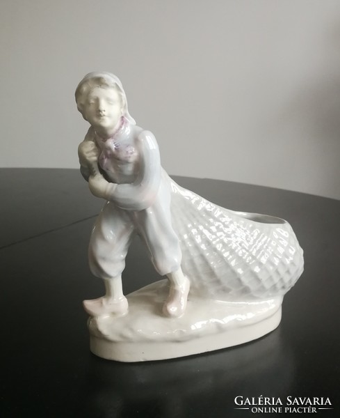 Antique statue - the boy pulling the net