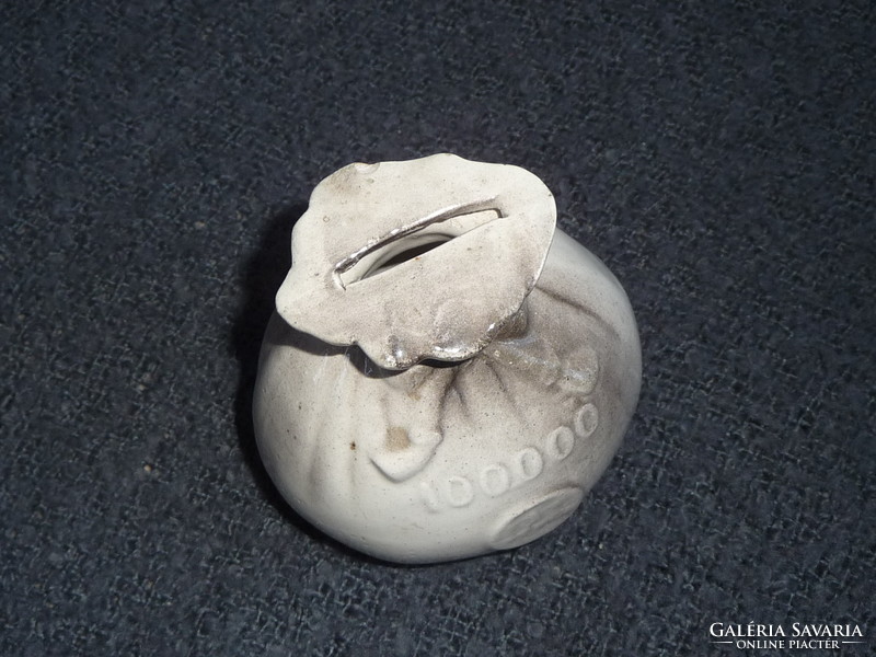 Old porcelain socket in the shape of a money bag. Earthenware socket in the shape of a money bag. 100-year-old socket figure