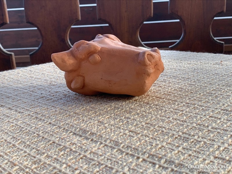 Marked terracotta cow head, mark m 2002.