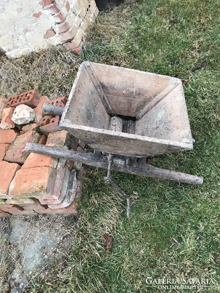 Grinding antique grape and fruit grinder from the last century - a curiosity from the wine estate