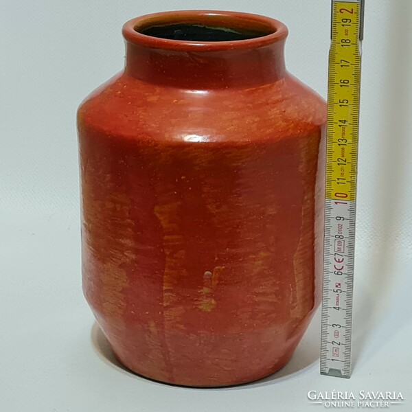 Orange glazed ceramic vase marked 