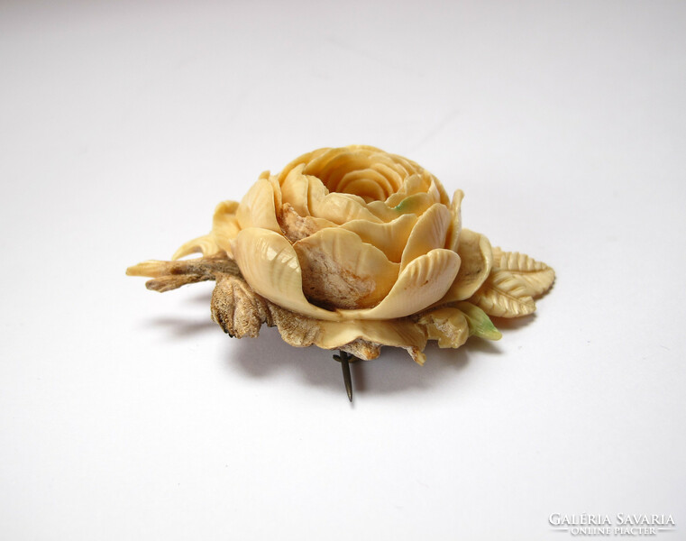 Rose brooch carved from old, exotic bone.