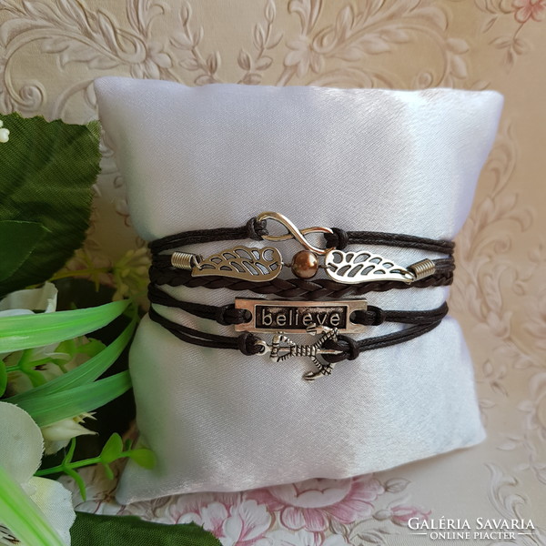 New, brown leatherette bracelet with metal decorations - anchor, believe, wing, infinity sign
