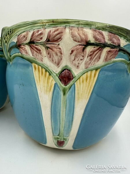 A large Art Nouveau faience vase in a pair