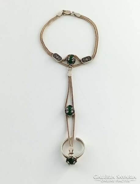 Silver bracelet with ring and green stones