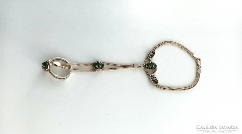 Silver bracelet with ring and green stones