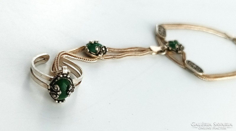 Silver bracelet with ring and green stones