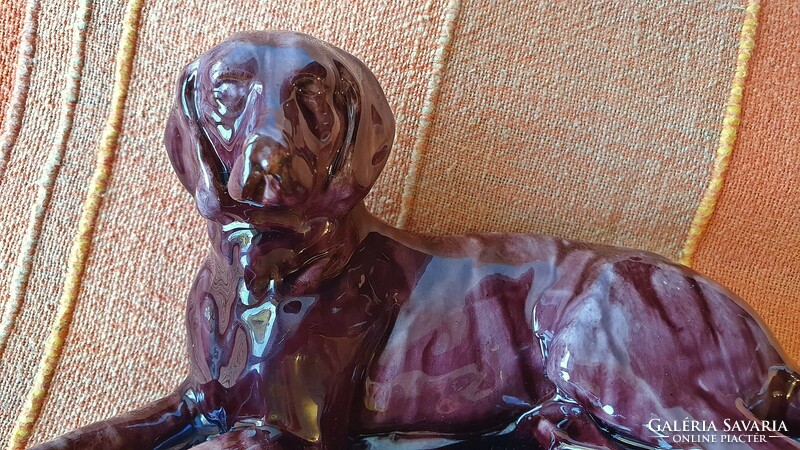 Large old ceramic dog. Injured. 20 cm long.