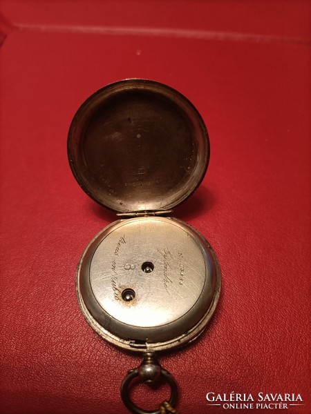 Flawless silver pocket watch with key