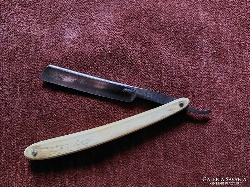 Antique bone-handled razor / barber accessory