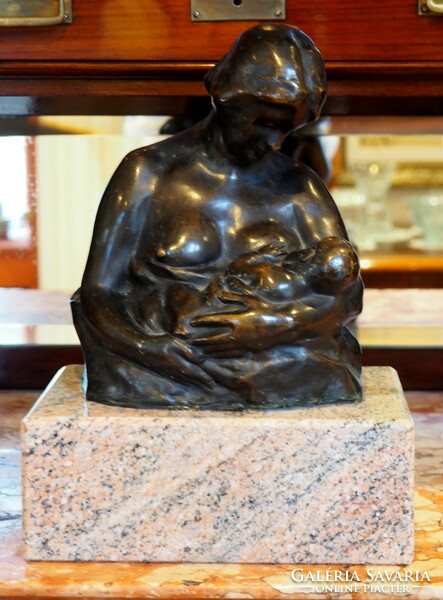 Mother with child, bronze statue on a marble plinth