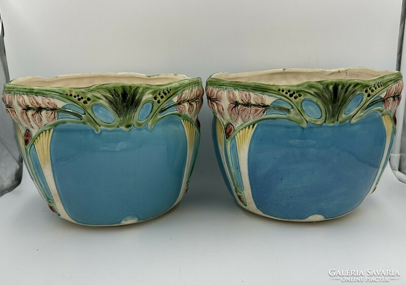 A large Art Nouveau faience vase in a pair