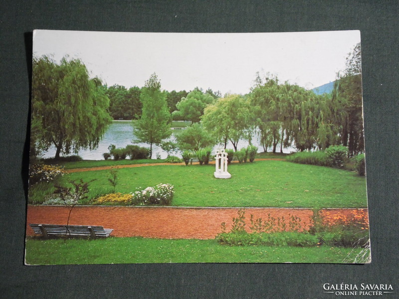 Postcard, lake for boating in a forest, park detail, spatial plastic sculpture