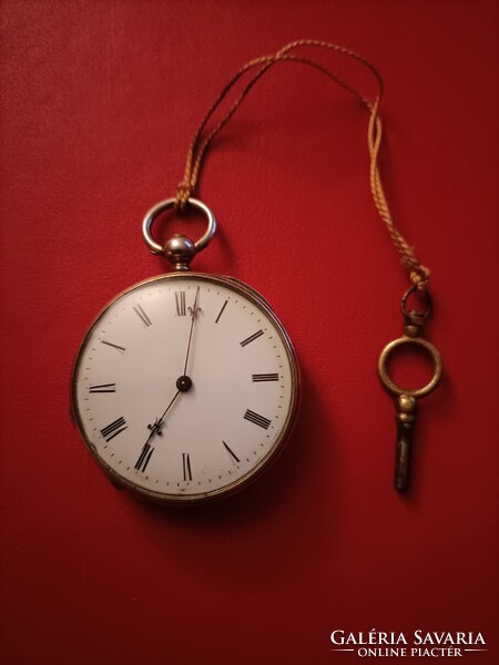 Flawless silver pocket watch with key