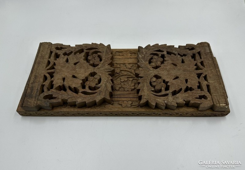 Carved bookend with grape and flower ornamentation