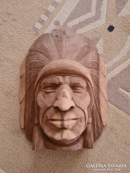 A large Indian head carved from wood can also be hung on the wall