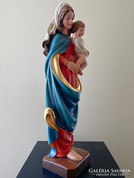 Beautiful wooden carved statue of Virgin Mary with child
