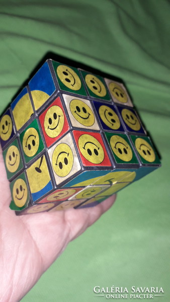 Retro interesting smiley magic cube, rubick-like game cube according to the pictures