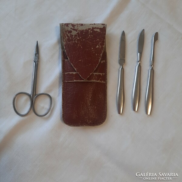 Old, special manicure set with marked Solingen scissors, in a leather case.