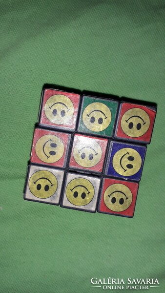 Retro interesting smiley magic cube, rubick-like game cube according to the pictures