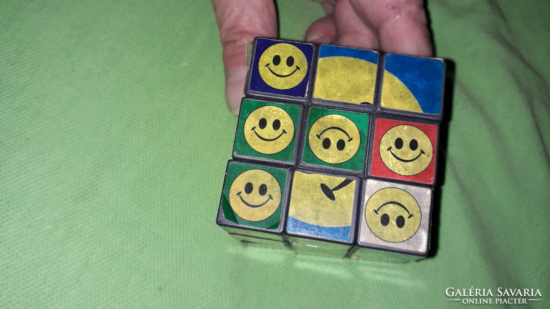 Retro interesting smiley magic cube, rubick-like game cube according to the pictures