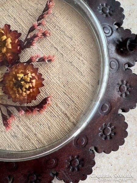 Retro wall decoration - dried flowers under glass in a leather frame.