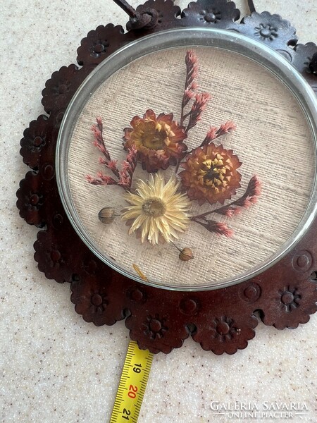 Retro wall decoration - dried flowers under glass in a leather frame.