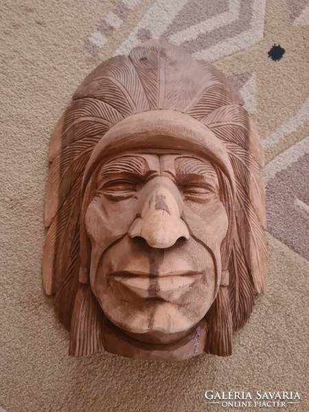 A large Indian head carved from wood can also be hung on the wall