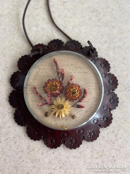 Retro wall decoration - dried flowers under glass in a leather frame.