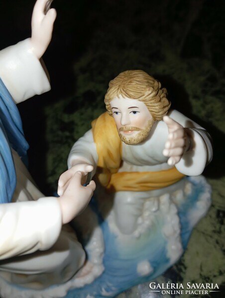 Porcelain statue of Jesus. Prayer.