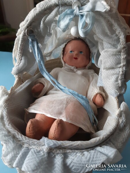 Old vintage baby in cradle