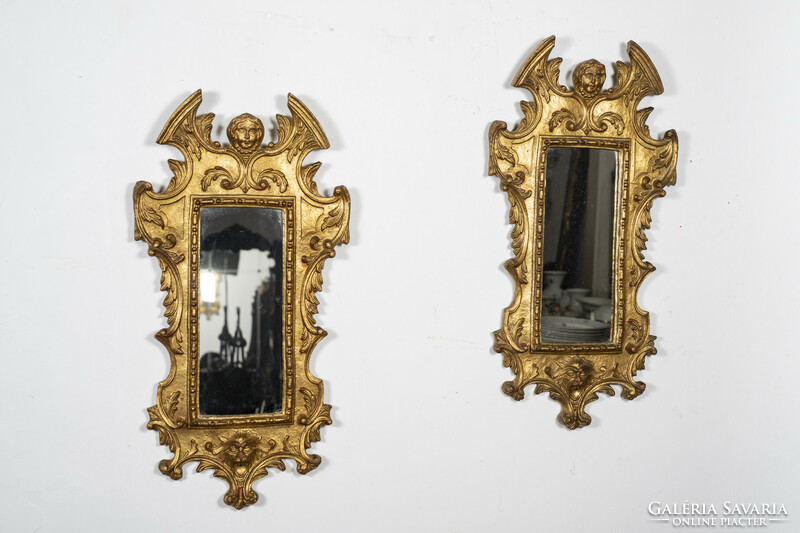 A pair of gilded wooden framed mirrors