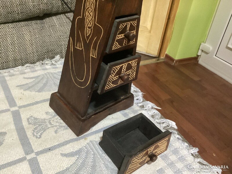 A small cabinet in the shape of a pyramid