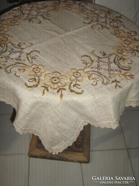 Beautiful floral hand-embroidered woven tablecloth with a lace edge
