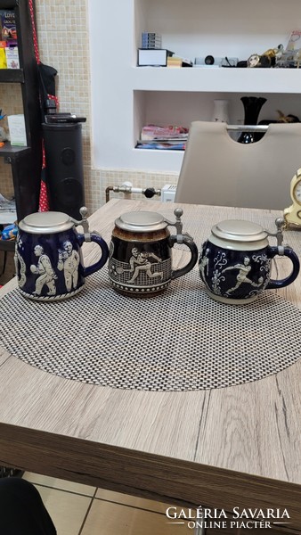 3 porcelain cups with tin lids. Bowling, soccer, tennis.