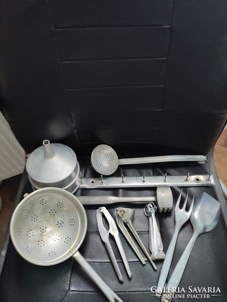 Peaceful-retro aluminum kitchen utensils mixed in one.