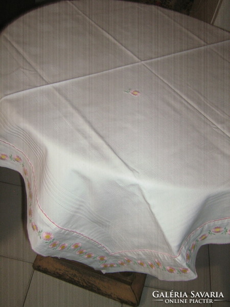 Charming antique white checkered damask tablecloth trimmed with floral ribbon