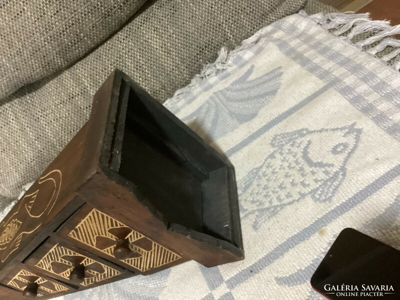 A small cabinet in the shape of a pyramid