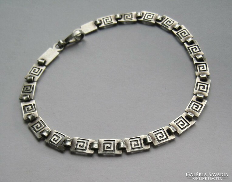 Silver bracelet with a tribal, openwork pattern